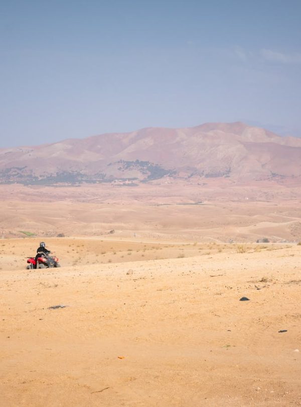 Group of quad bikers exploring the vast Agafay desert near Marrakech, Morocco.