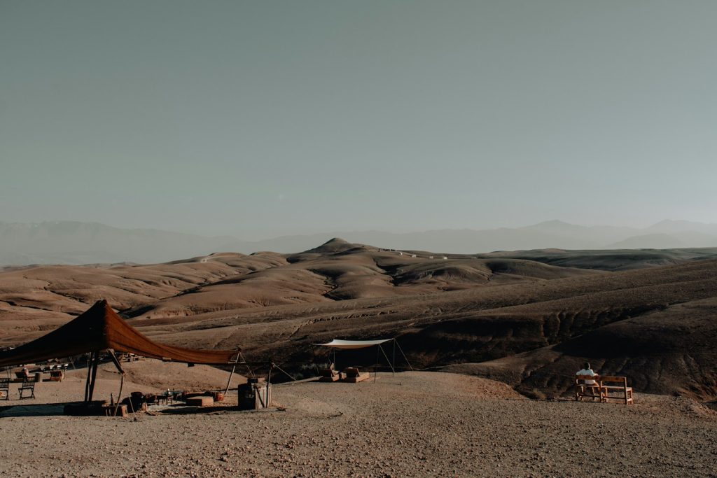 a tent set up in the middle of a desert