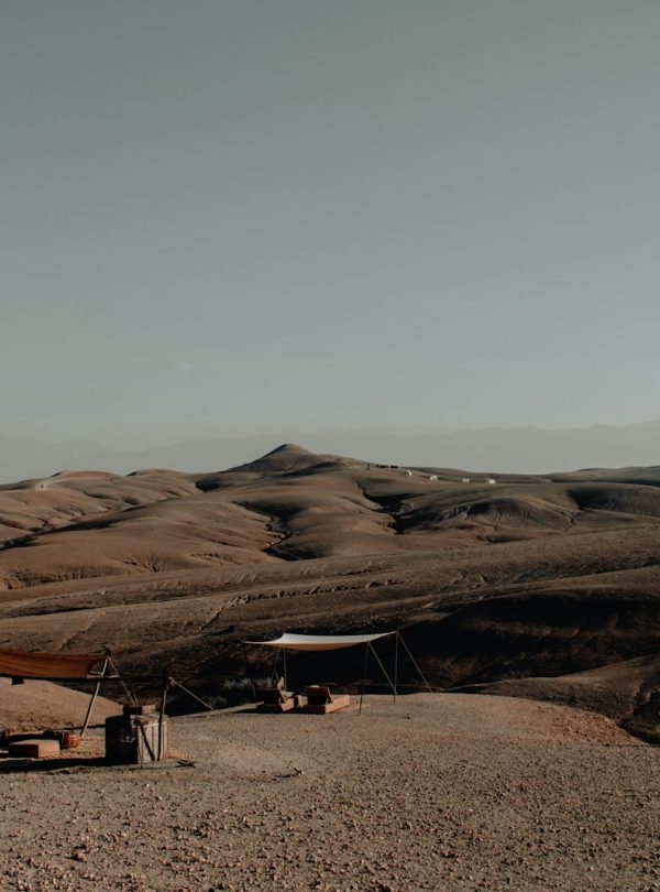 a tent set up in the middle of a desert