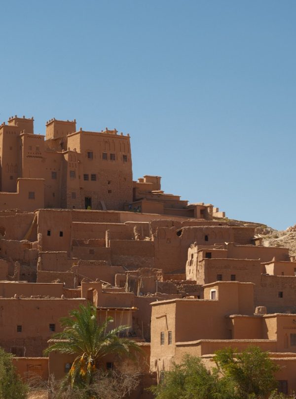 Ancient mud-brick village under a clear blue sky
